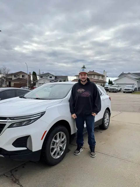 A Shift Happens Auto Sales customer with their 2022 Chevrolet Equinox on handover day