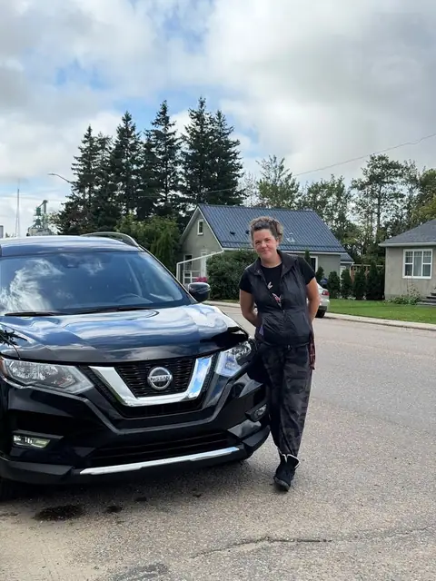 A Shift Happens Auto Sales customer with their vehicle on handover day
