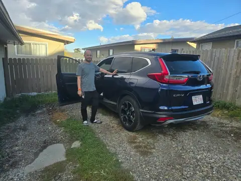 A Shift Happens Auto Sales customer with their vehicle on handover day