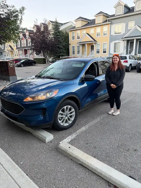 A Shift Happens Auto Sales customer with their vehicle on handover day