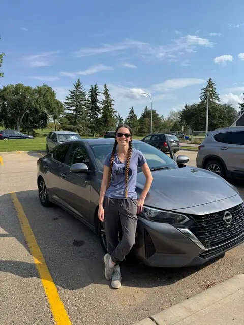 A Shift Happens Auto Sales customer with their vehicle on handover day
