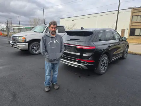 A Shift Happens Auto Sales customer with their 2021 Lincoln Corsair on handover day