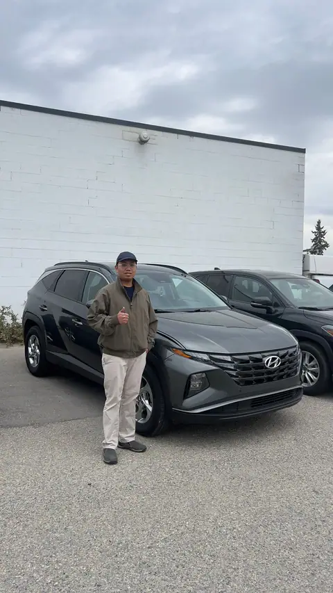 A Shift Happens Auto Sales customer with their vehicle on handover day