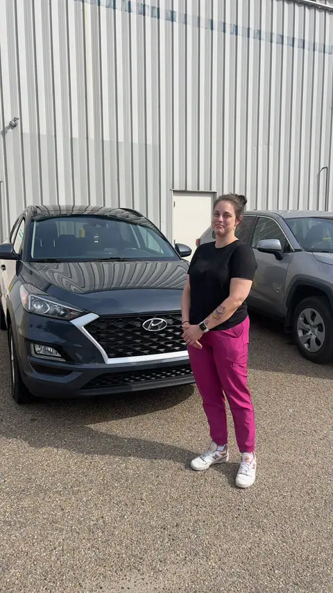 A Shift Happens Auto Sales customer with their vehicle on handover day