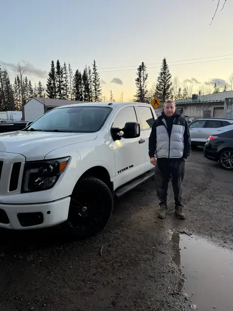 A Shift Happens Auto Sales customer with their 2019 Nissan Titan on handover day