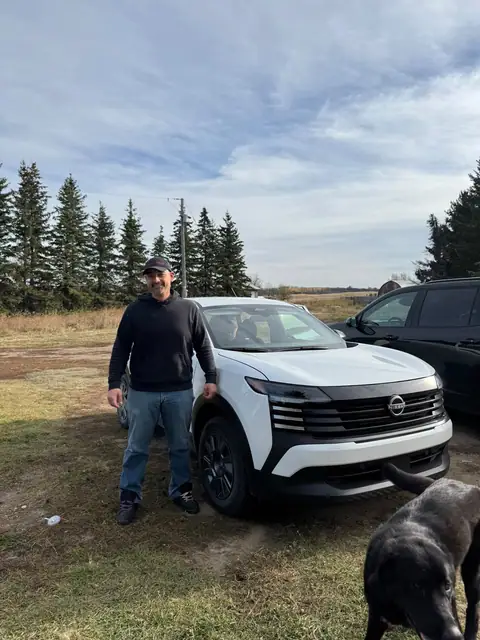 A Shift Happens Auto Sales customer with their vehicle on handover day