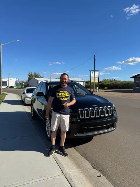 A Shift Happens Auto Sales customer with their vehicle on handover day